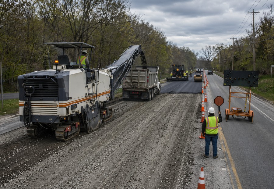 Municipal roadway paving and reclamation equipment on a public road